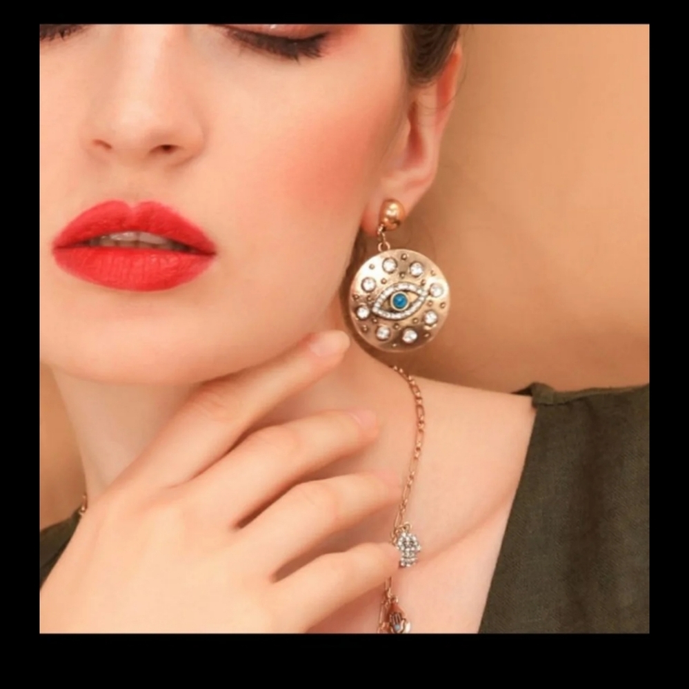 Beautiful brass eye earrings